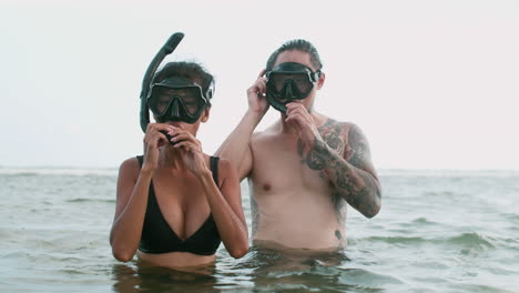 couple with diving goggles on