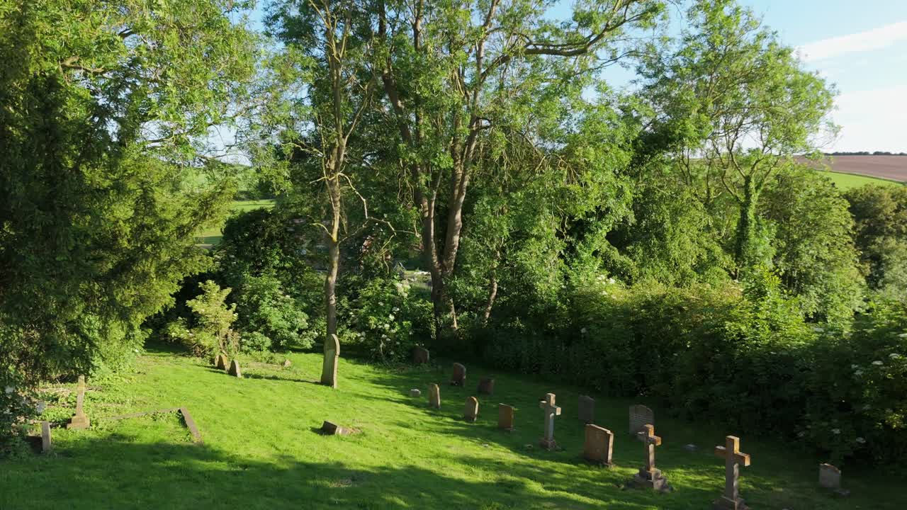 Quaint rural village church graveyard in a small, picturesque rural setting. St Mary's Church on the High Street of Burwell a peaceful atmosphere, beautiful natural landscapes, rolling hills