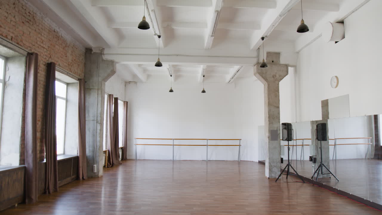 Empty Dance Studio with Ballet Barres and Mirrors