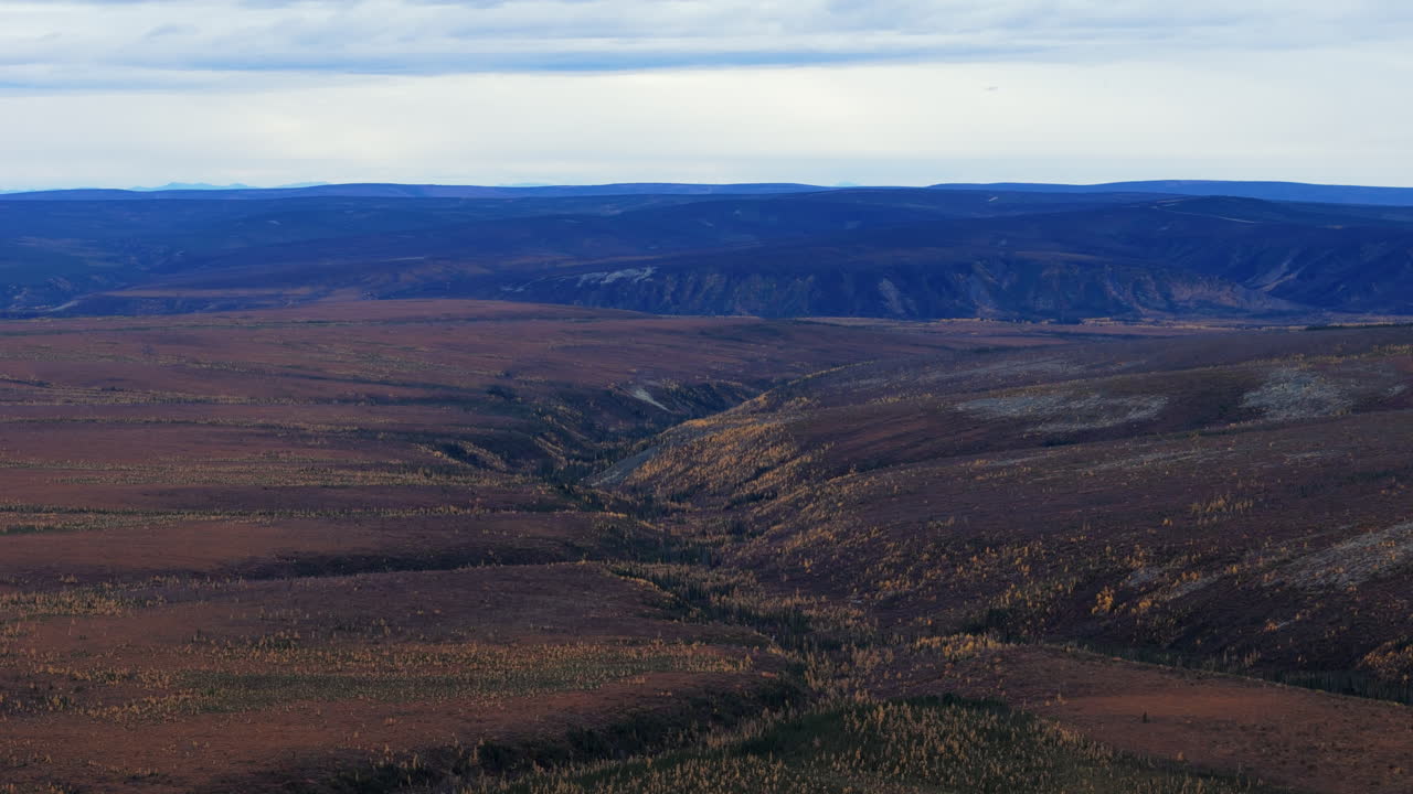 Aerial View of a Remote Mountain Valley in Autumn