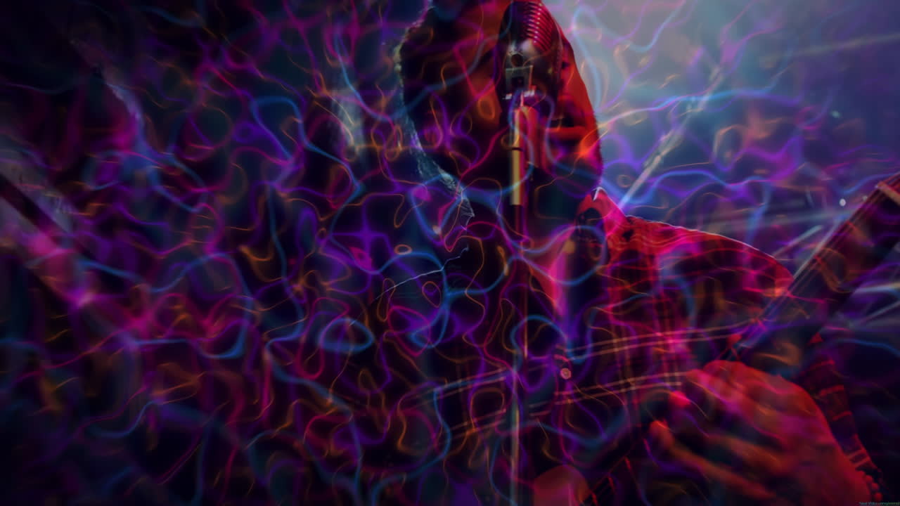 Bandmates performing live music on stage with neon projections swirling across mic and guitar