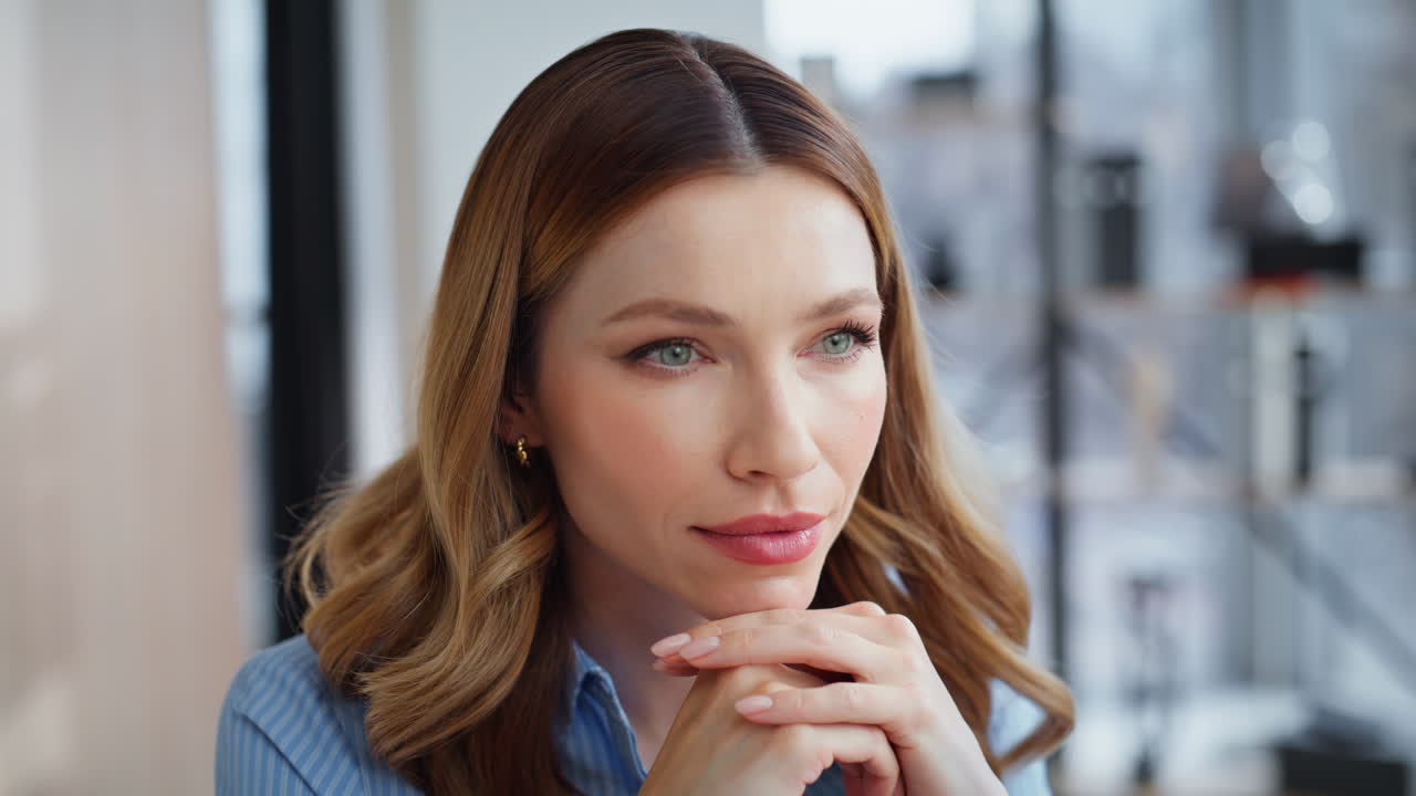 Portrait woman ceo thinking career sitting modern company office looking ahead