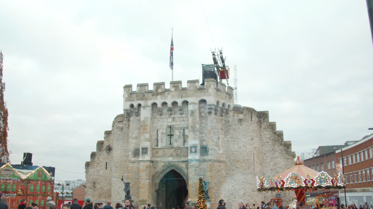 shot pans down toreveal the bargate arch in southampton at christmas time
