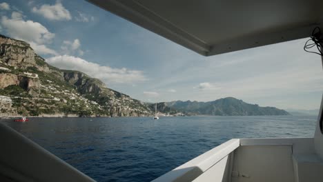 view of italian coast from sailing yacht on the mediterranean sea