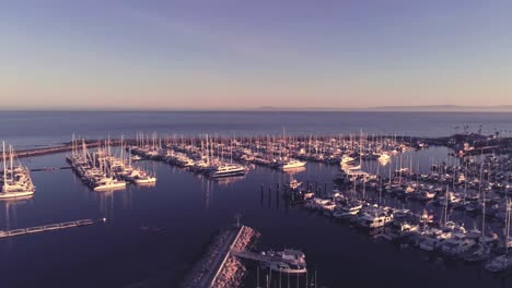 a drone pan over an evening marina sunset