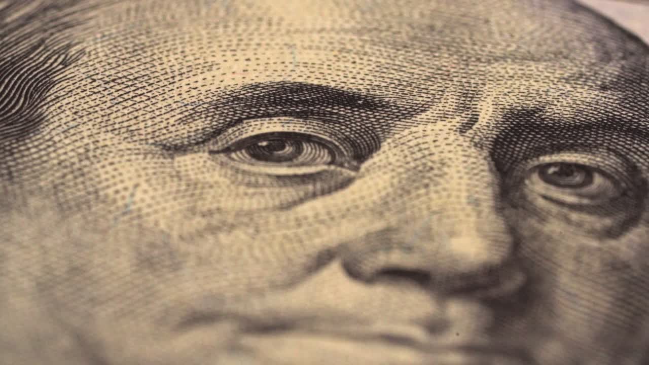 Close-up view of currency featuring a notable figure