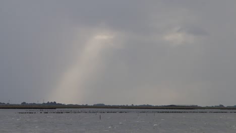 shaft of sunlight over sea. wadden sea. netherlands