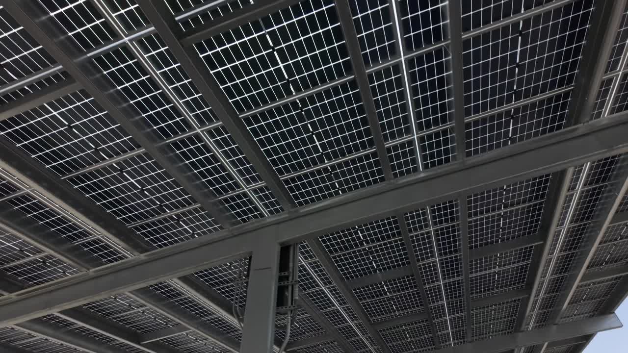 View from under a solar panel structure in a parking lot or similar use, aerial view