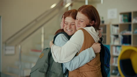 two red-haired girls hugging in a school hallway