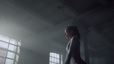 girl preparing body for strength exercises. bodybuilder warming shoulders