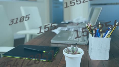 Animation-of-numbers-changing-over-desk-with-tablet-and-laptop