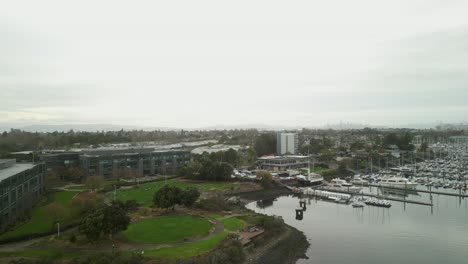 an overhead view of mariner square in alameda, showcasing its intricate dock system and the quiet elegance of its marina.