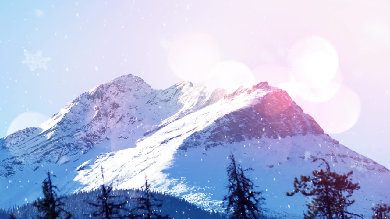 Animation of snow falling in winter landscape with mountains