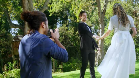 photographer taking photo of groom and bride 4k 4k