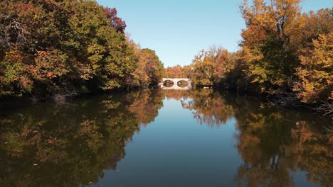 huron river in oakwoods metropark with colorful trees, wayne county michigan, usa