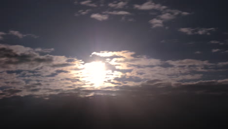 Shining-sun-and-sunbeams-through-clouds.-Timelapse