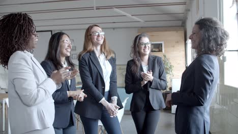 Businesswomen-applauding-to-boss-in-office