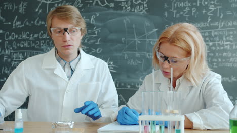 Scientists Conducting Experiments in a Chemistry Lab
