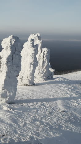 frozen rock formations in snowy mountains