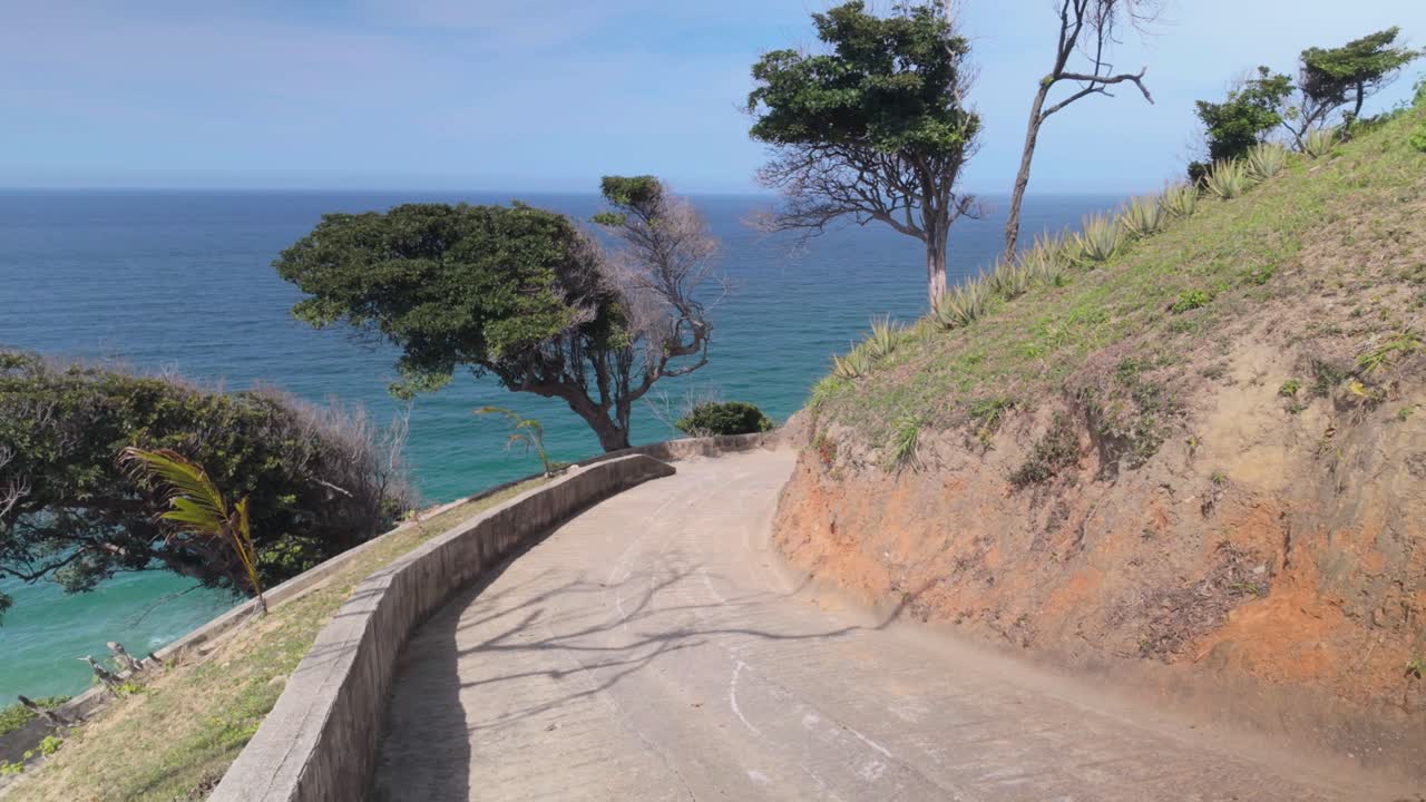 A winding mountain road in the hills with a view of the Caribbean Sea, Venezuela.