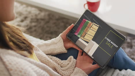 caucasian woman using tablet at home online shopping on cyber monday sale day, slow motion