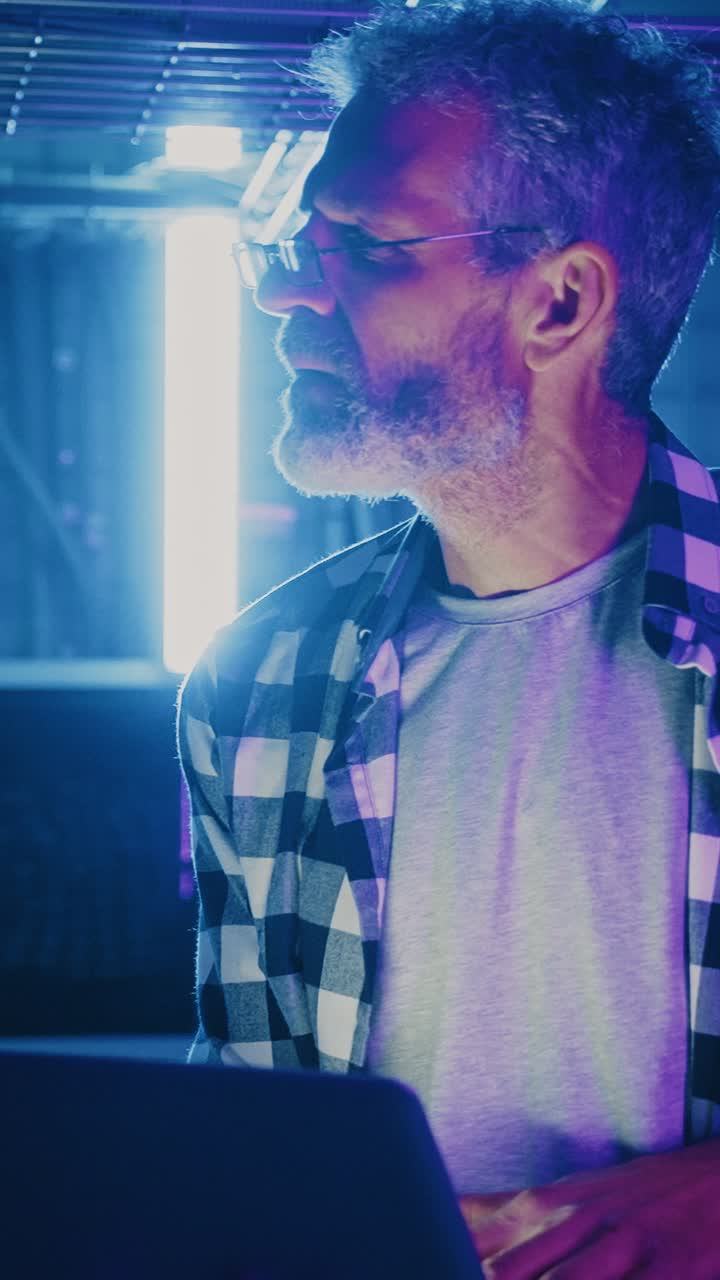 Man working on a laptop at night