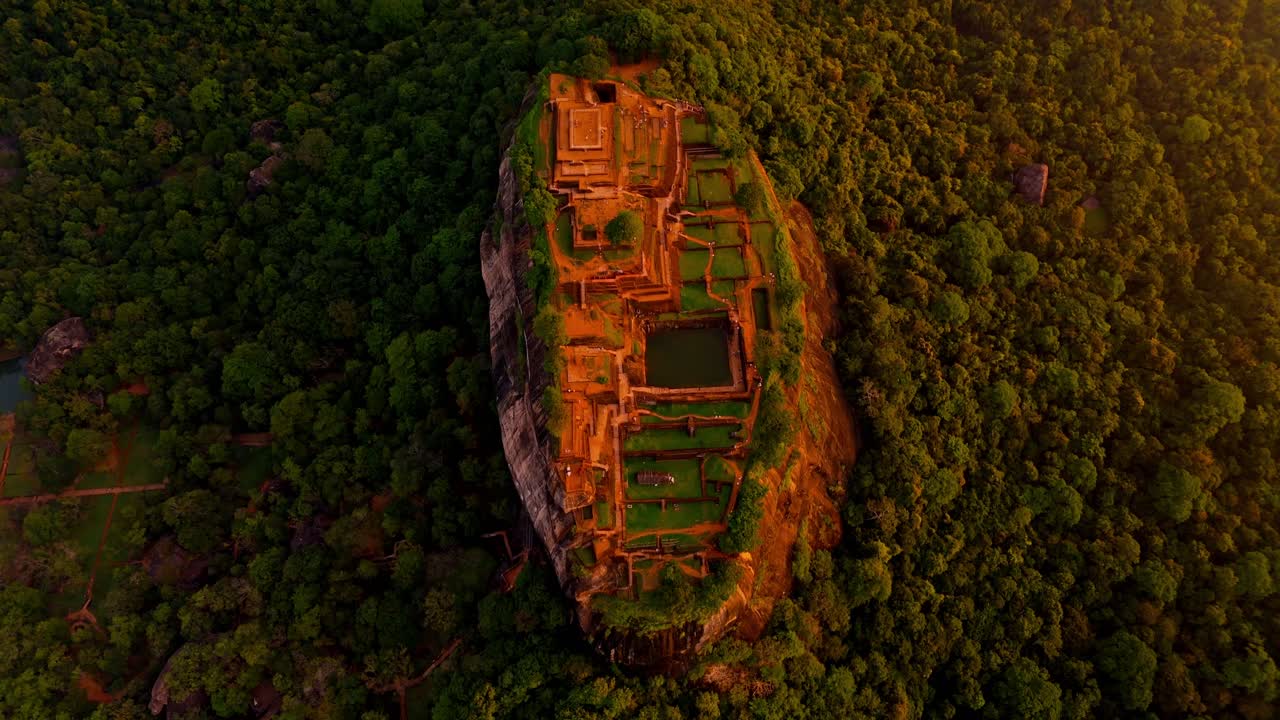 Soaring above the misty jungles of Sri Lanka, this drone clip captures the iconic Sigiriya Rock at sunrise.