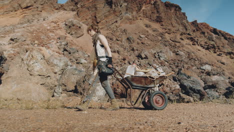 female survivor pulling cart in post apocalypse world