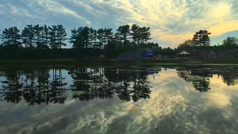 Sky-reflecting-off-a-shallow-lake-in-Carver,-Massachusetts