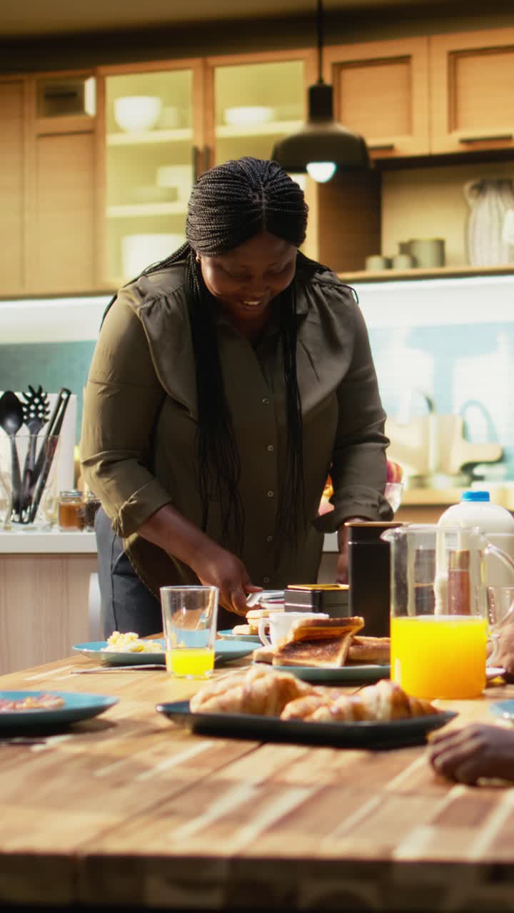Vertical Video Mother preparing packed lunch in box for children at school