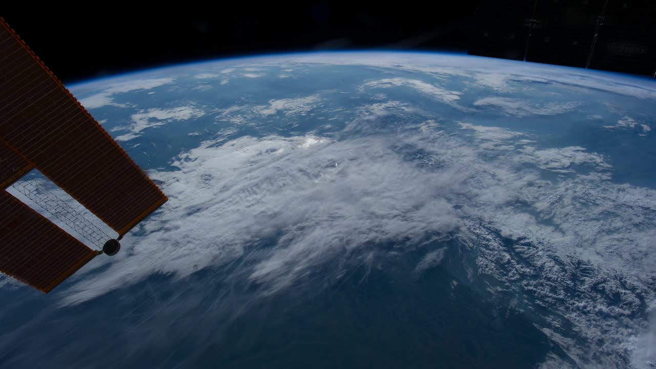 Flying over the earth's surface, shot from the space station.