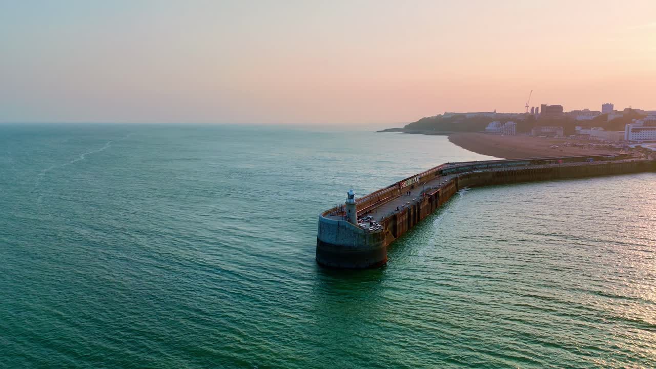 By the sea where the breezes charm, Stretches Folkestone’s Harbour Arm