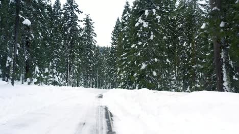 Aerial-view-of-snow-covered-road-in-the-winter