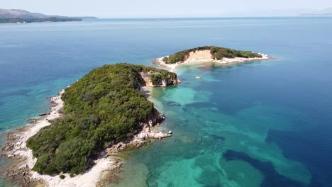 ksamil islands, albania - slow aerial of small white beach and sand strip