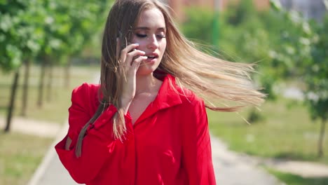 beautiful woman talking on phone. happy woman calling with cell telephone outside
