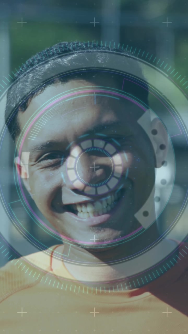 Scope scanning over digital interface with data processing against male soccer player smiling