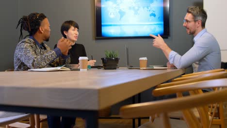 business colleagues discussing in the conference room at office 4k