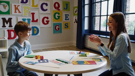 Child and Teacher Engaging in Educational Activities in a Classroom