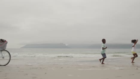 family enjoying free time by the sea