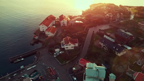 Beautiful-Houses-In-The-Port-Of-Lysekil,-Sweden-On-A-Sunny-Weather---Aerial-Shot