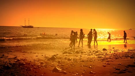 amazing seaside destination silhouetted people family volvanic rock beach golden hour travel holidays vacation leisure time tranquility serenity relaxed ocean paradise sunset party summertime activity