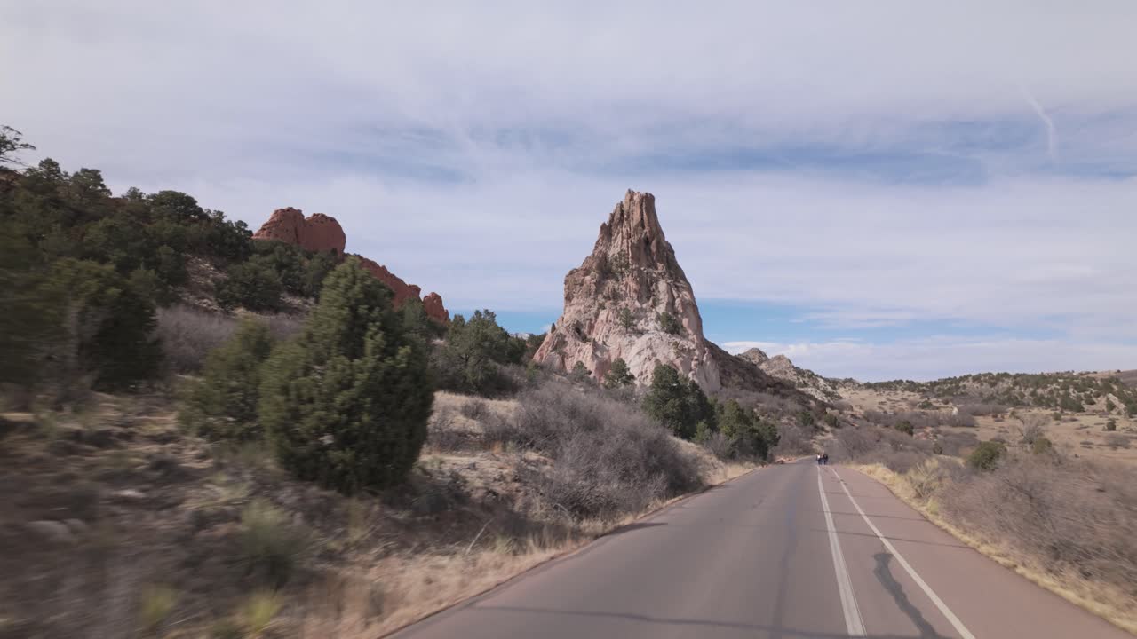 Driving On The Road Through The Colorado Garden of the Gods Park In Colorado Springs, Colorado, USA. POV Shot