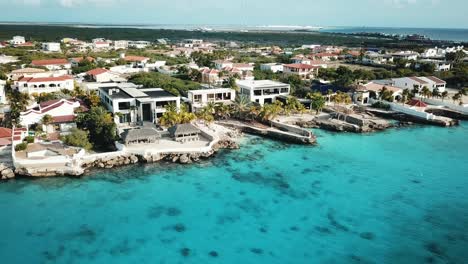 panoramic drone view of the luxurious villas on the coast of bonaire, in the dutch caribbean, south america