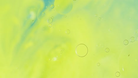 Animation-of-bubbles-moving-on-green-liquid-with-copy-space