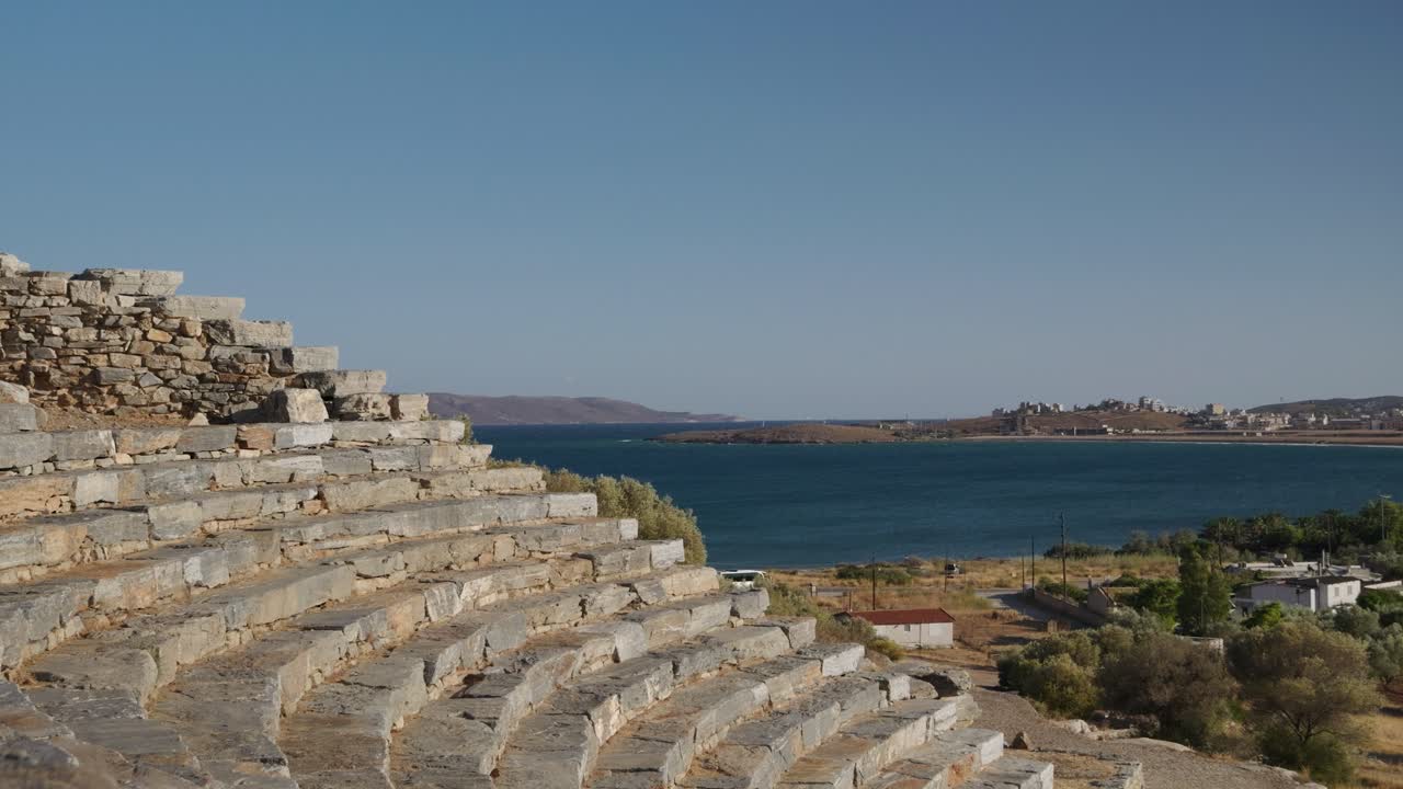 Stone steps at Ancient Theatre of Thorikos in Greece with ocean in background
