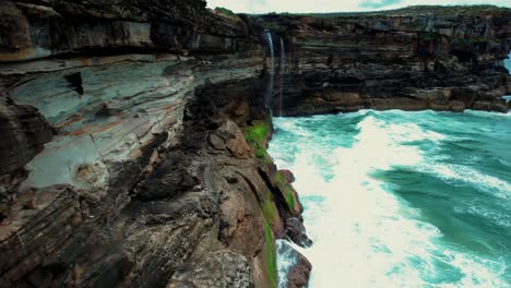 curracurrong falls, australia drone ascending downward pan view