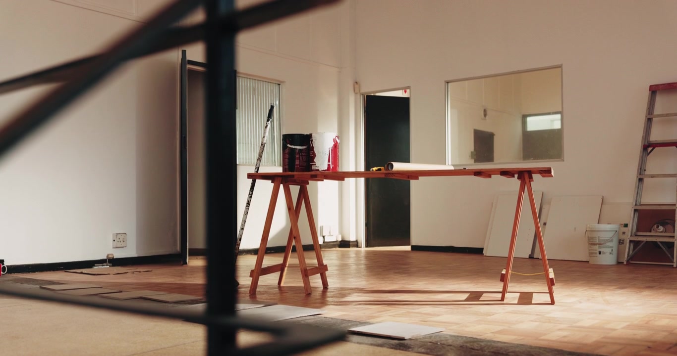 Empty Room Under Renovation with Wooden Trestle Table