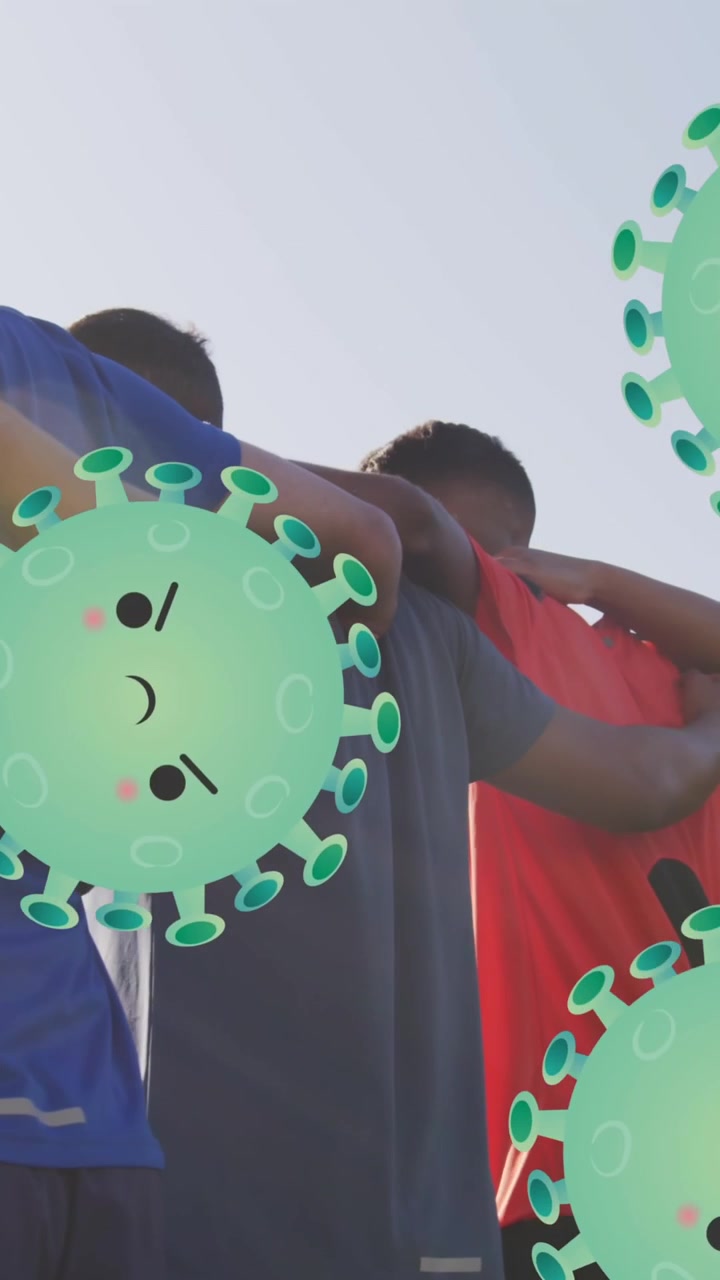 Animação de células de vírus sobre diversos jogadores de futebol masculinos