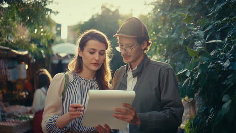 couple reviewing notes in an outdoor setting