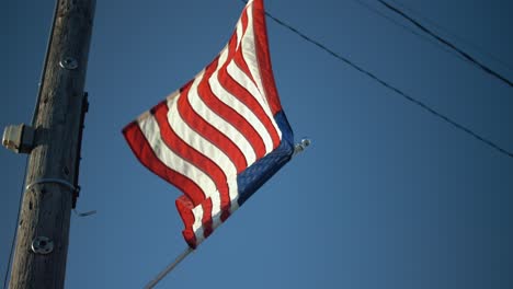 USA-American-flag-flying-in-small-town-for-4th-of-July